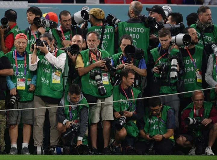 Photographers take their position ahead of the start of the Qatar 2022 World Cup round of 16 football match between Argentina and Australia at the Ahmad Bin Ali Stadium in Al-Rayyan, west of Doha on December 3, 2022. (Photo by FRANCK FIFE / AFP)