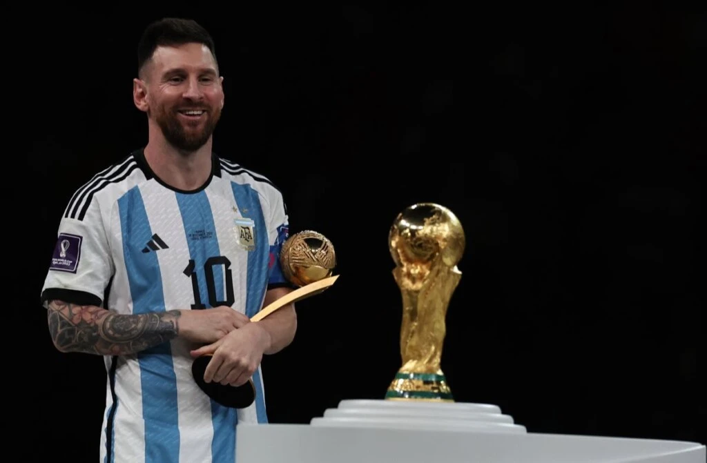 Argentina’s Argentina's forward Lionel Messi celebrates with the trophy after become champion during the World Cup FIFA Qatar 2022 final match between Argentina and France at Lusail Stadium in Doha, Qatar, on December 18, 2022. (Alejandro PAGNI / PHOTOXPHOTO)